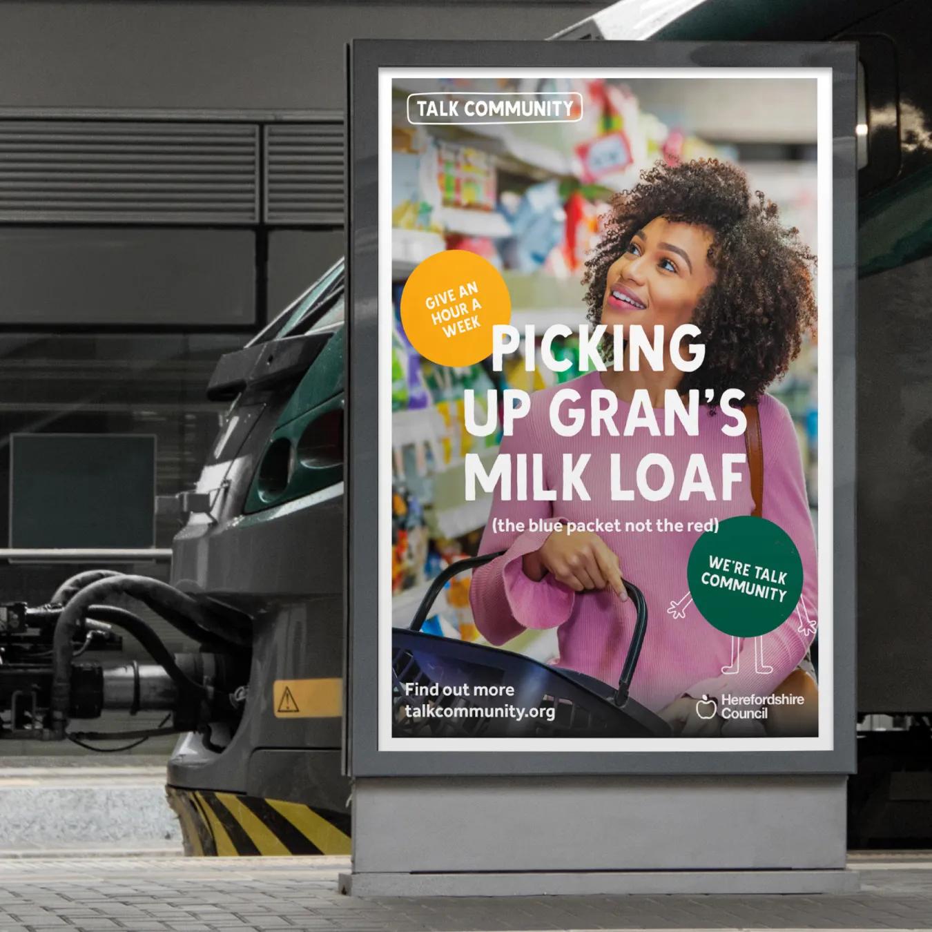 Advertisement on a train platform with the caption 'picking up gran's milk loaf'