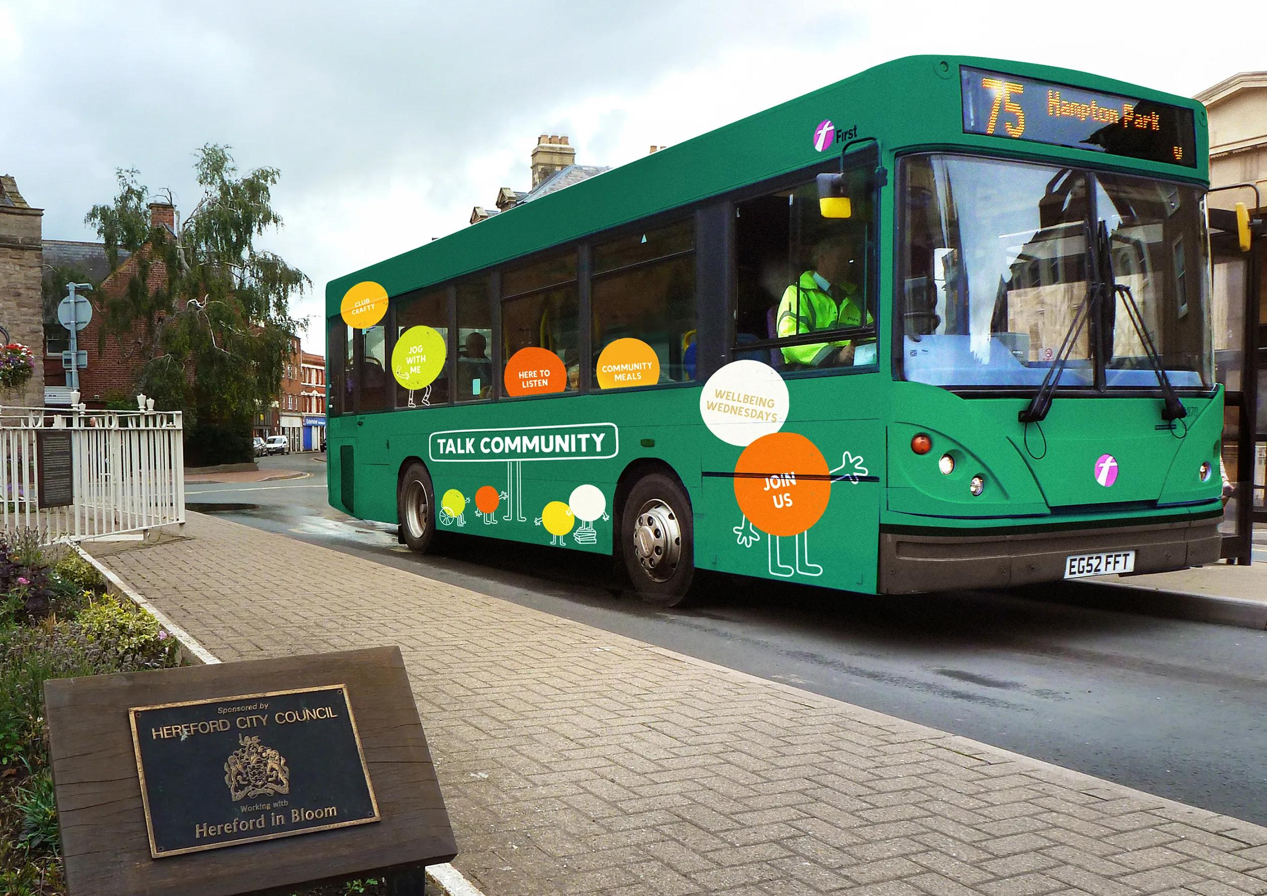 Branded bus with characters and the talk community logo