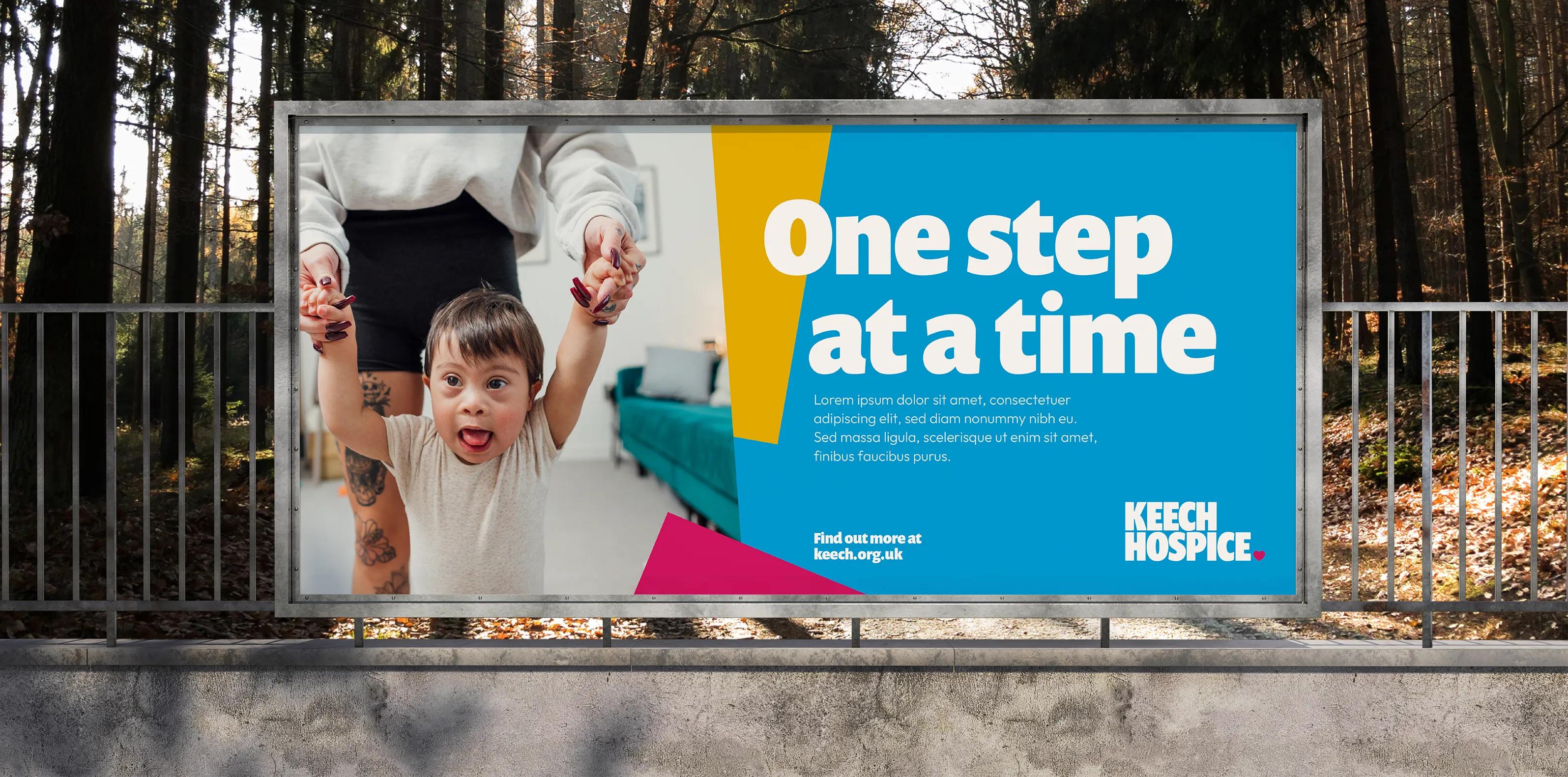 outdoor advertisement saying 'one step at a time'