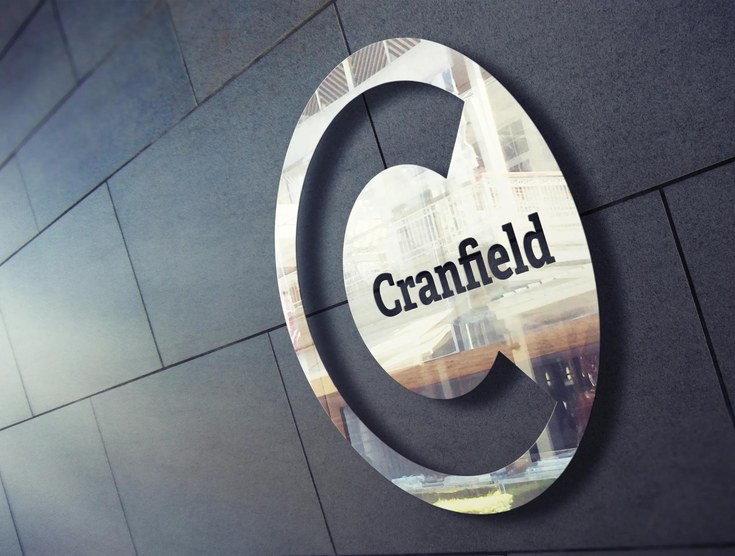 Cranfield logo on the wall in metal