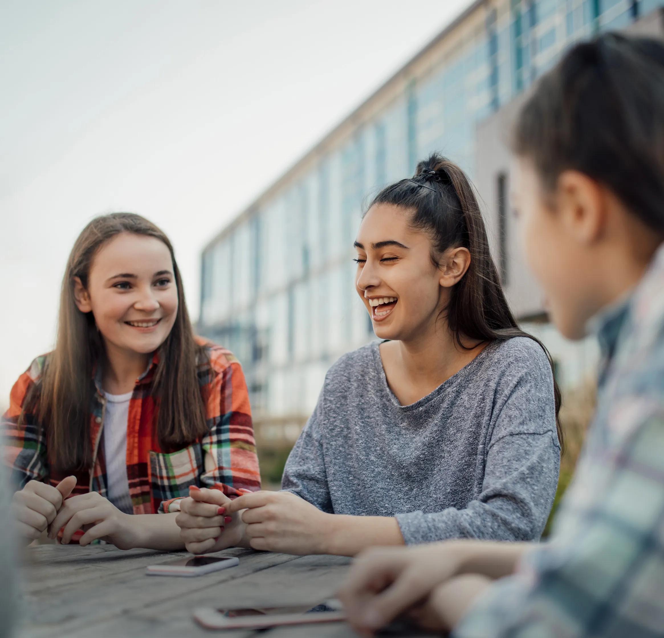 Young people talking round a table