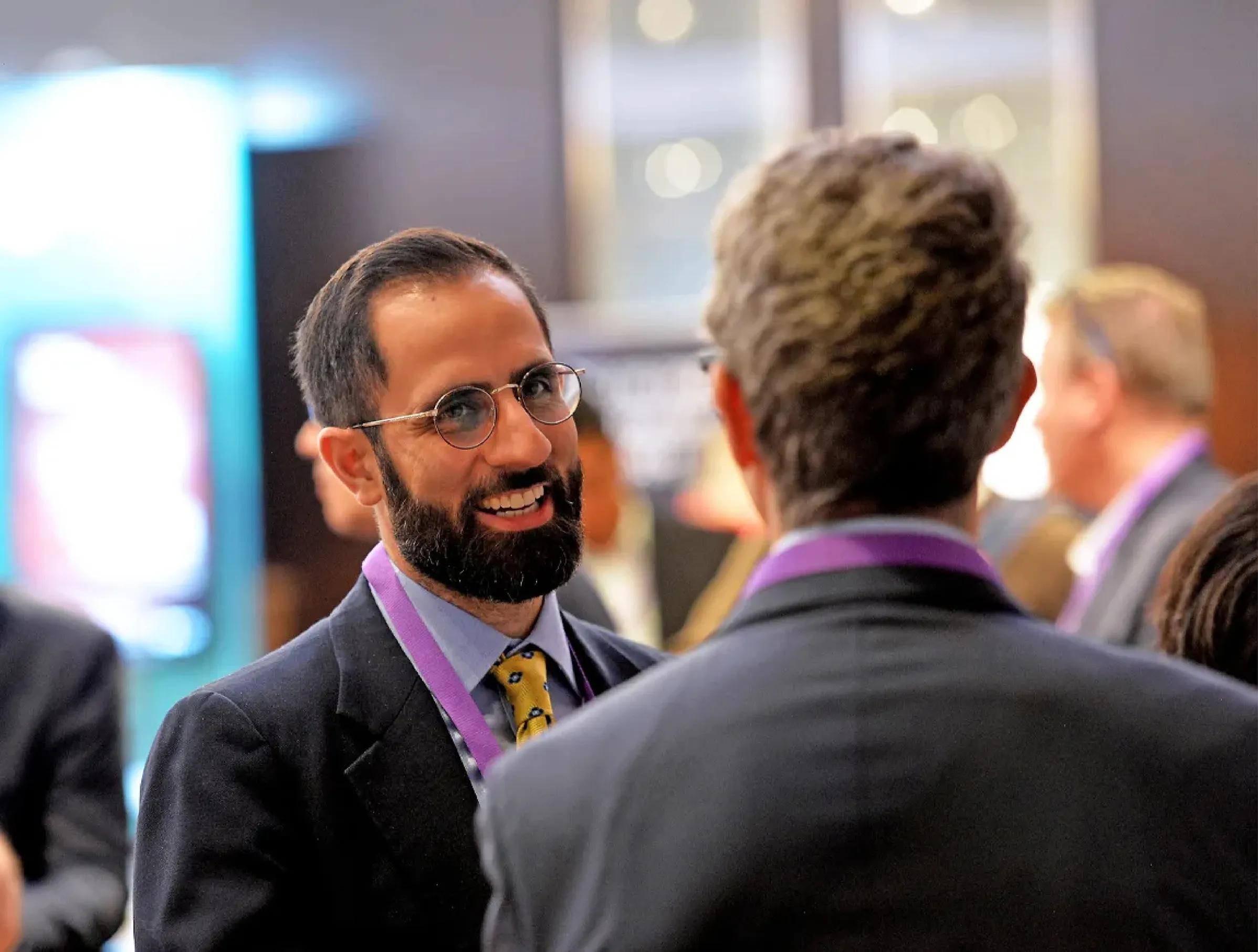 PVRI conference showing two men talking
