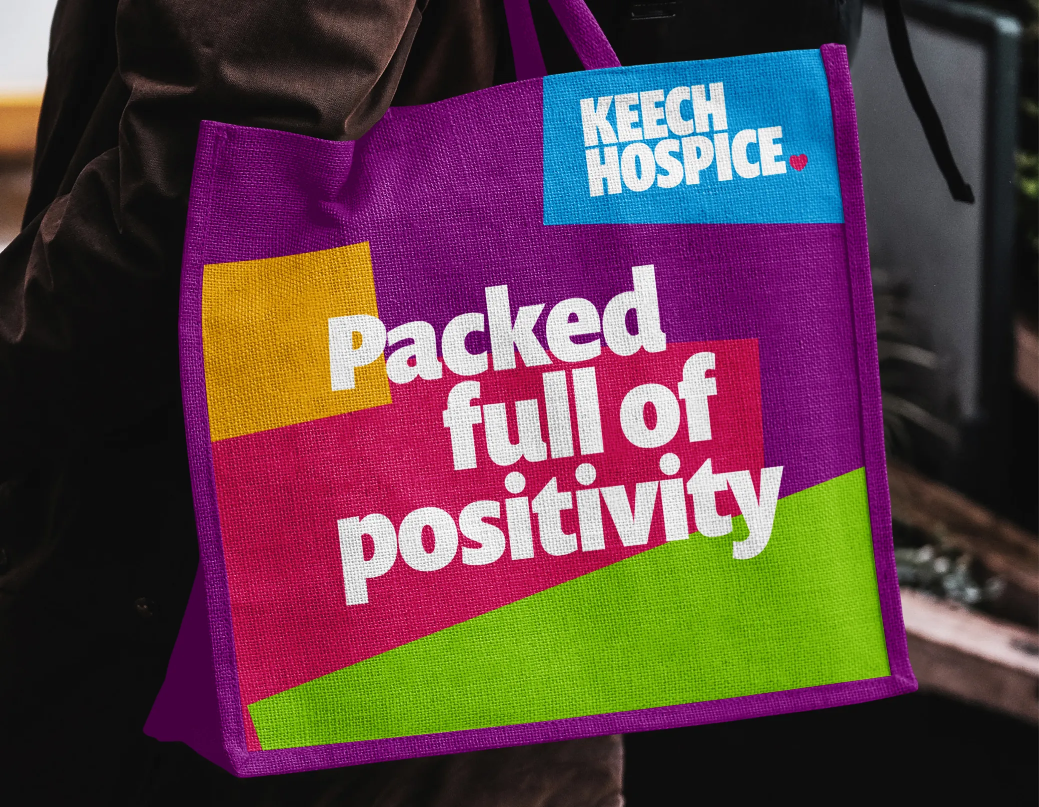 Keech branded tote bag with the caption 'packed full of positivity'