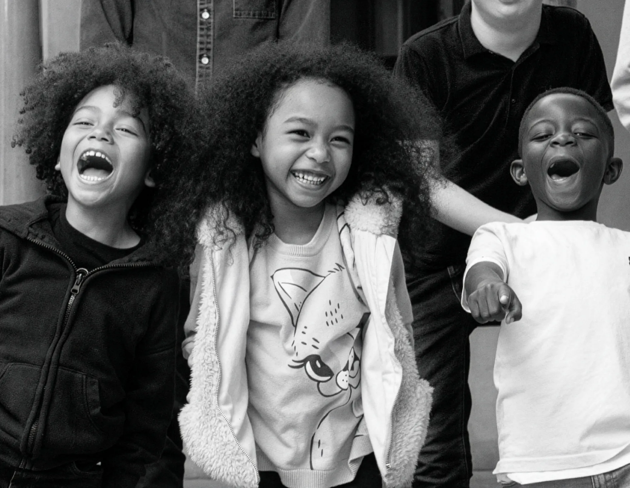 3 children laughing 