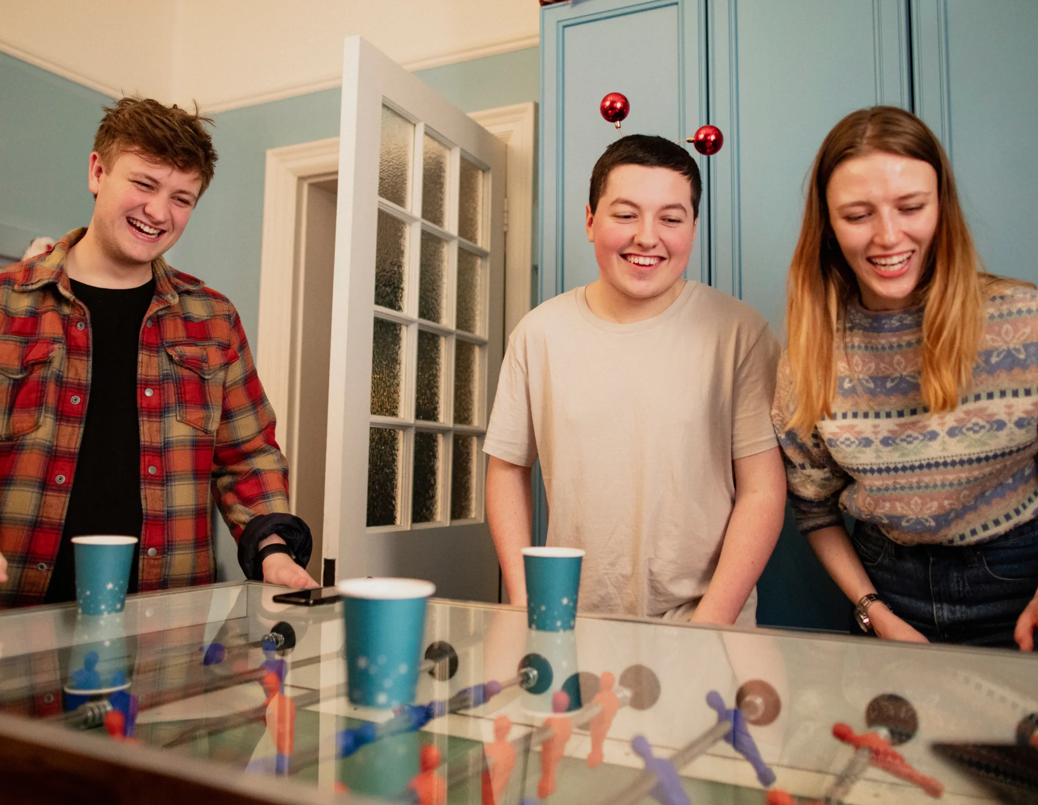 people playing foosball